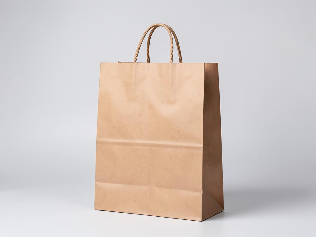 Landscape Paper Bags — Wide-format kraft paper bags with twisted handles, printed with your logo in Dubai.
